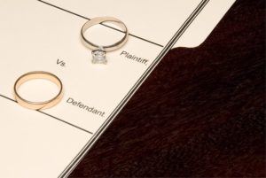 wedding rings representing plaintiff and defendant in divorce in court