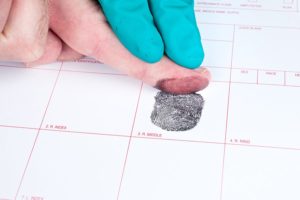 being fingerprinted for a crime