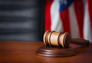 gavel on its side with american flag background